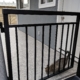 Aluminum picket gate at top of deck stairs